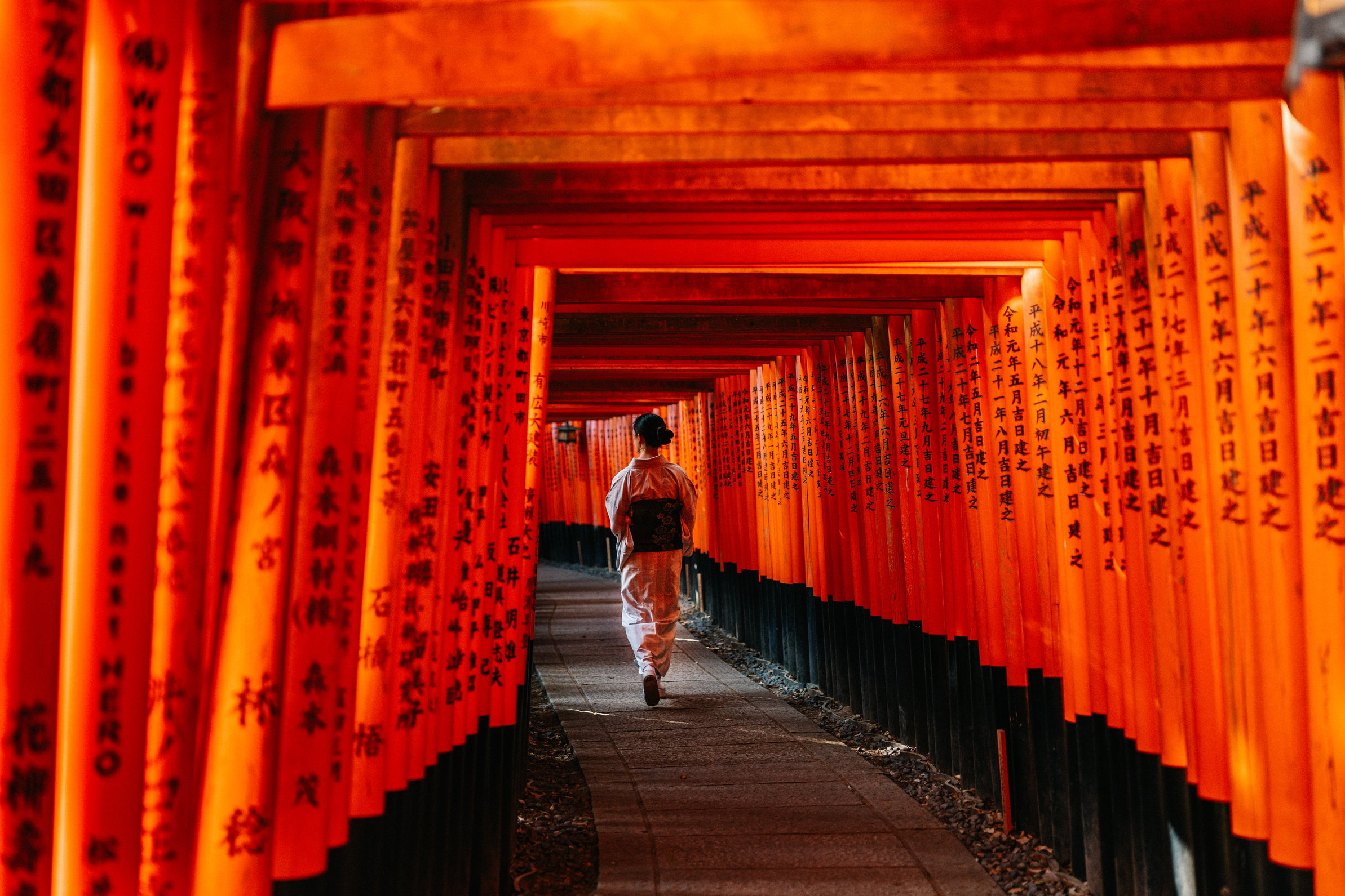 Red Torii Tunnel at Fushimi Inarioka Kyoto with a Lady in Kimono